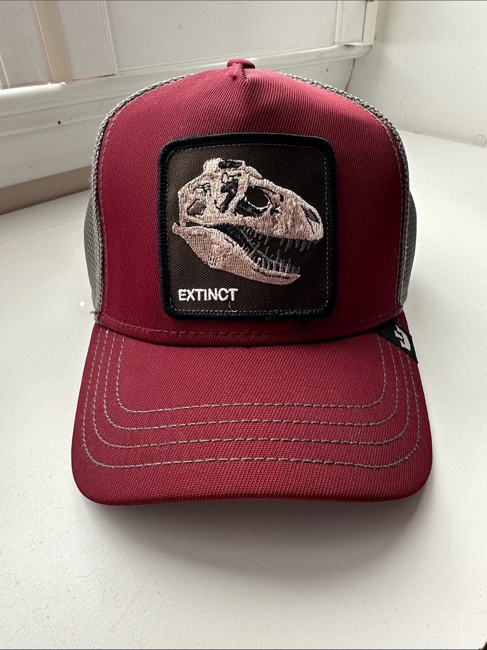 Goorin Bros Burgundy Trucker Hat with Dinosaur Skull Patch